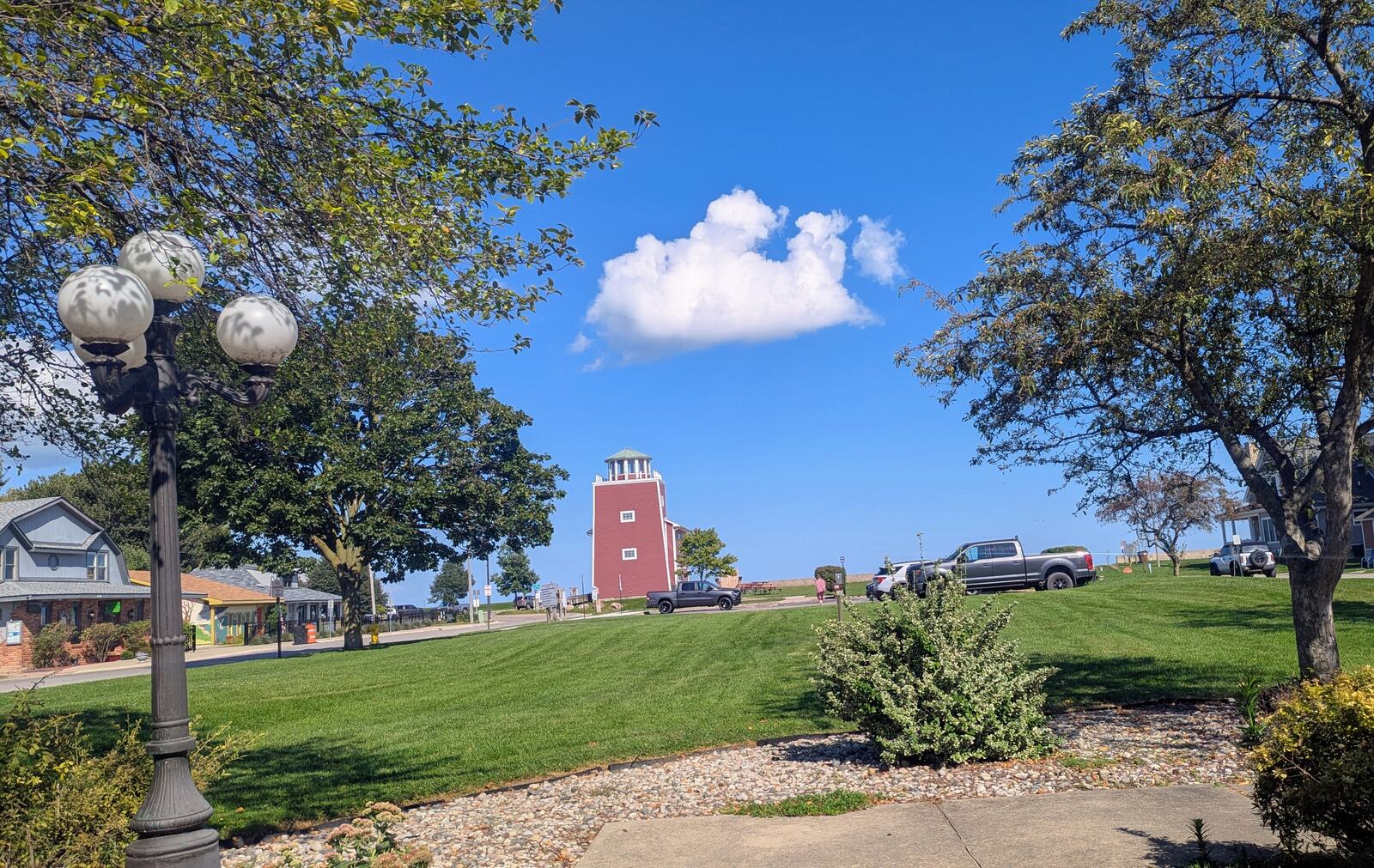 The beach-side park at Luna Pier, Michigan, on a clear August afternoon, looking out over the water under a blue sky.